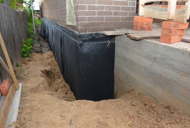 SJ Waterproofing Pros technician performing targeted Basement Waterproofing assessment in Greensburg, KY